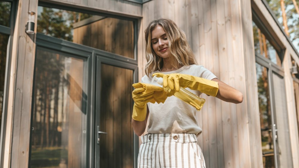 A woman cleaning a door